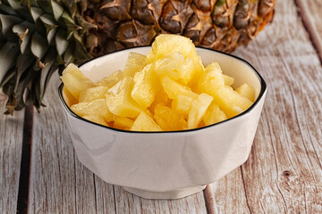 Sweet canned pineapple fruit pieces