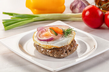 Beefsteak chop with roasted egg