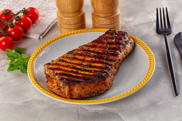 Grilled pork steak with bone