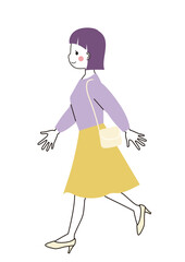 歩いているスカート姿の若い女性