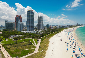 Miami cityscape with luxury skyscrapers and ocean. Panoramic drone view of Miamis famous coastline. Miami Beach from above. Miami skyline from top. Aerial cityscape of Miami, Florida.