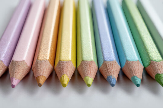 Pastel glitter colored pencils close up