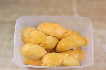 tropical fruit durian in a food storage container