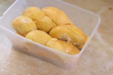 tropical fruit durian in a food storage container