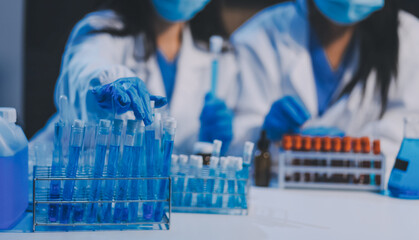 Research, experiment and medical trial being done by a scientist in a lab, science facility or hospital. One young, serious and professional researcher organizing, sorting or making a discovery