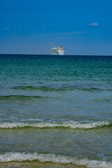 Cruise ship on the ocean. Luxury liner at sea. Miami Beach with cruise ship. Sea water and cruise liner. Tourist cruise ship near coast. Ocean waves and vessel boat. Summer dream vacation. Boat trip.