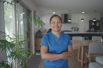 Asian health care worker at client home, home nurse, home care service concept
