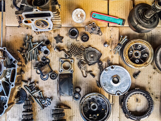 Old parts of motorcycles background. Repair and maintenance old parts of engine. Old motorcycle...