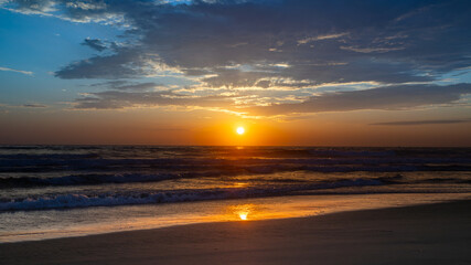 Sun setting over the Pacific Ocean from Mission Beach in San Diego, California, USA taken on June 1, 2025