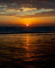 Sun setting over the Pacific Ocean from Mission Beach in San Diego, California, USA taken on June 1, 2025