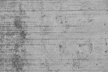 A weathered concrete surface with visible cracks and texture