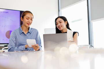 Business asian woman Reviewing Documents, business woman's hands meticulously reviewing a stack of...