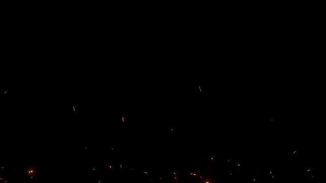 Animated glowing sparks flying across a dark background. Perfect for cinematic transitions, fire effects, or abstract ambient visuals in sci-fi or action scenes.