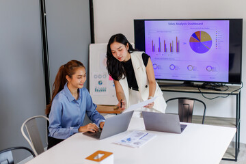 Team of Business asian woman Reviewing Documents, business woman's hands meticulously reviewing a...