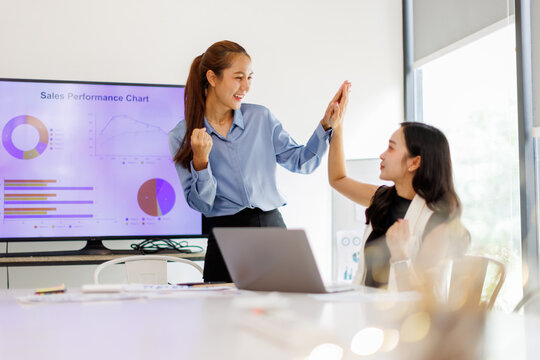 Excited asian Business team celebrating success during a meeting in an office, business finance and taxation planning concept.
