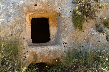 View of rock tombs in the prehistoric Necropolis of Pantalica, Sicily. Now a UNESCO World Heritage Site. Italy. Europe.