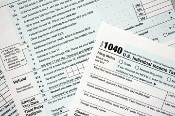 1040 US individual income tax return form blank close up. Few pages of united states tax blank