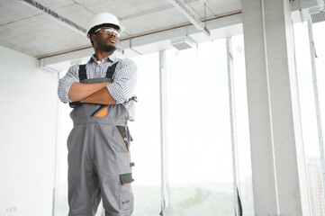 Fototapeta premium African american engineer at work on construction site