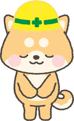 お辞儀をする黄色ヘルメットを被った茶色の柴犬