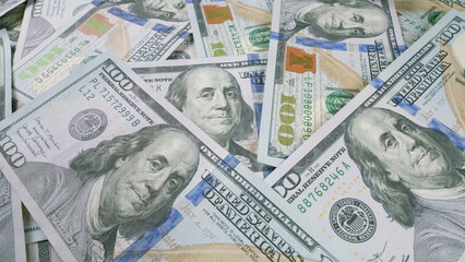 A CloseUp View of Numerous U.S. Hundred Dollar Bills Piled in Abundance and Piled Up