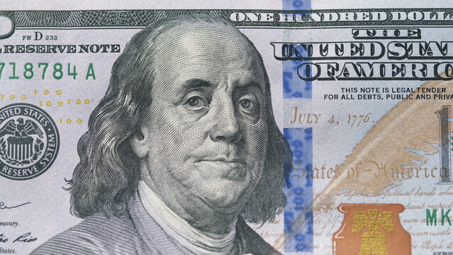 A Detailed View of a U.S. One Hundred Dollar Bill Featuring the Portrait of Benjamin Franklin