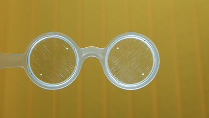 Handheld Bagolini glasses or filter, medical tool to use during optometrist eye exam. Vision test...