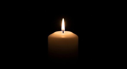 Burning Candle on Black Background