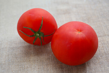 fresh summer vegetables on a linen tablecloth, tomato