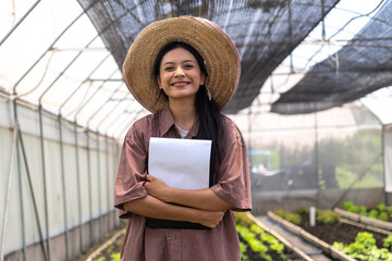Children learn to grow vegetables and collect data from experimental vegetable plots in a temperature-controlled greenhouse.
