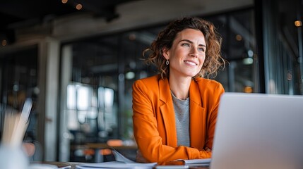 confident women reviewing project data by large office window 
