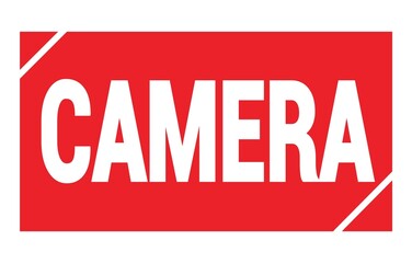 CAMERA text written on red stamp sign.