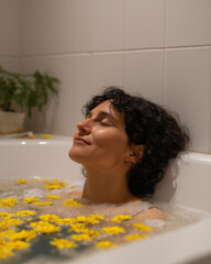 Relaxation and tranquility of a person enjoying a floral bath at home surrounded by yellow flowers