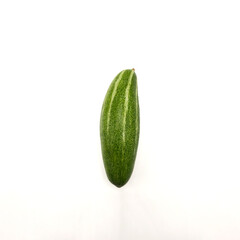 Potol or pointed gourd vegetable on isolated white background. Pointed gourds over white...