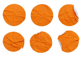 Set collection of blank crumpled orange paper stickers in round shape isolated on transparent...