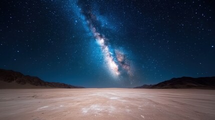 Fototapeta premium A breathtaking view of a vast desert under a dazzling night sky filled with stars, creating a serene atmosphere that reflects the beauty and vastness of the universe.