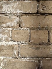 Old beige bricks with white mortar great for architectural backgrounds, construction references, and vintage wall visuals