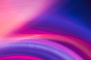 Abstract background of colorful swirls in pink purple and blue creates modern artistic vibe