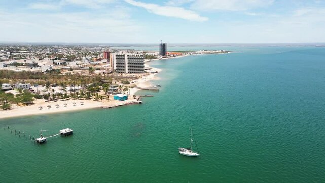 La paz beach, calm turquoise sea, and quiet hotel coast in mexico, aerial view