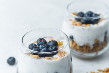 Yogurt granola parfaits topped with fresh blueberries