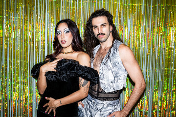 Queer Couple Celebrating at a Lively LGBT Gay Party in Vibrant Outfits