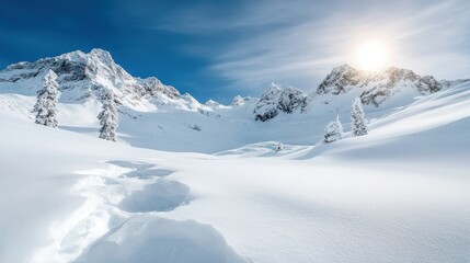 A breathtaking winter scene displays snow-covered mountains and a clear blue sky, depicting the serene beauty of nature in its purest and most tranquil form.