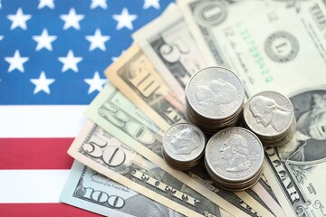 American US dollars money bills and on American flag close up