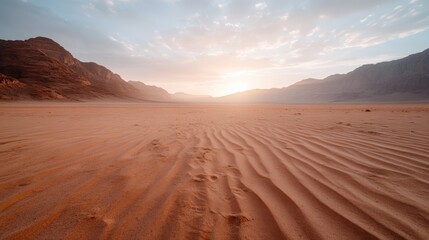 Fototapeta premium A breathtaking view of a vast desert landscape, illuminated by a soft golden sunrise, highlighting the beauty of nature and tranquility in the arid environment.