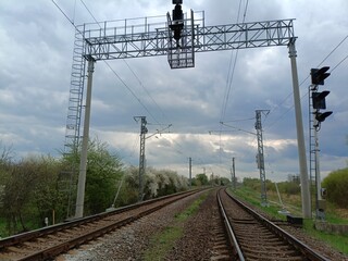 Two way railroad tracks in countryside. Two railway tracks. Cloudy day. Countryside. Fields and...
