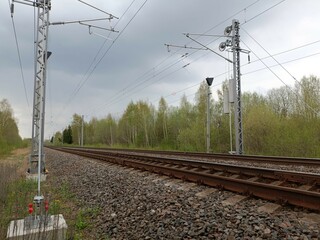 Two way railroad tracks in countryside. Two railway tracks. Cloudy day. Countryside. Fields and...