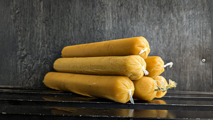 Siwil (steamed cracker dough, wrapped in lontong-shaped plastic) as a complementary ingredient for...