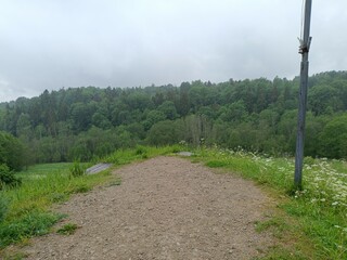 Bubiai hill during cloudy day. Small hill. Grass is growing on hill. Staircase leading to the top....