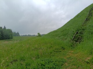 Bubiai hill during cloudy day. Small hill. Grass is growing on hill. Staircase leading to the top....