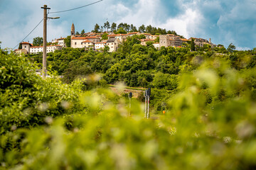 Scenic Hilltop Town Of Stanjel In Slovenia: Traditional Stone Houses And Historic Church Tower...