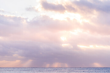 Obraz premium Serene Ocean Horizon At Sunset With Soft Pastel Colored Clouds. Tranquil Seascape, Pink Sky, Blue Water, Peaceful Nature Scene, Beautiful Calm